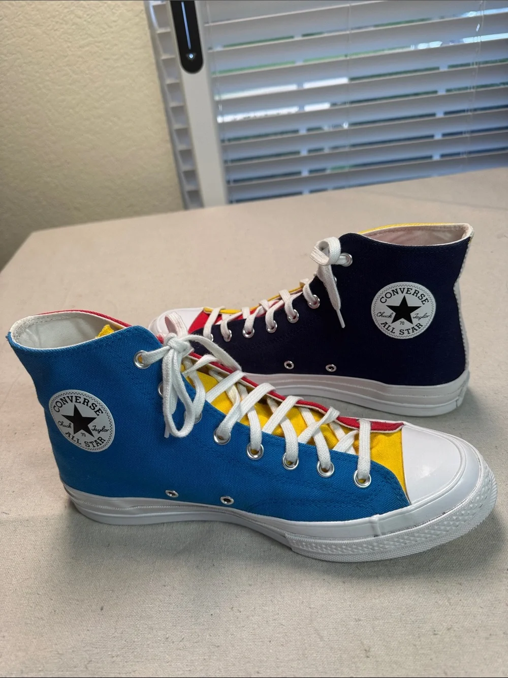 Converse All Star Chuck Golf Wang High Top Sneakers in Yellow, Blue, and Red.